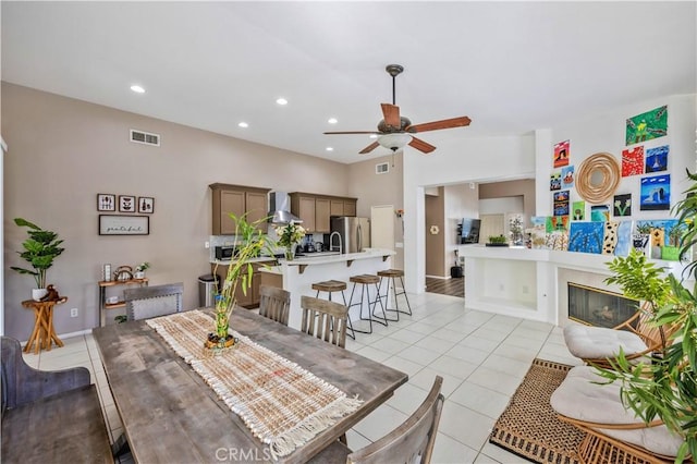 dining area with ceiling fan and light tile patterned floors