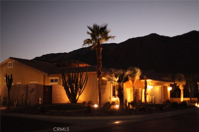 adobe home with a mountain view