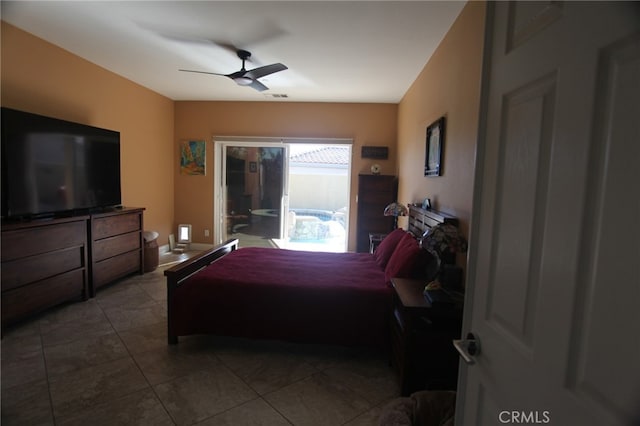 bedroom with ceiling fan and tile patterned flooring