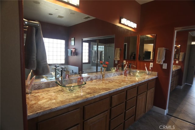 bathroom with tile patterned floors, separate shower and tub, and vanity