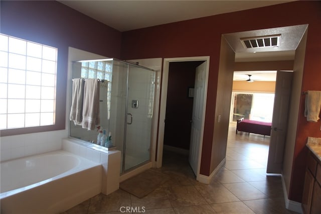 bathroom with vanity, independent shower and bath, and tile patterned flooring