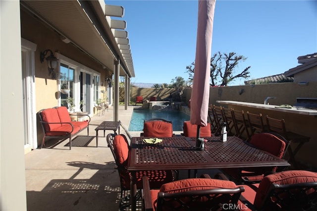 view of patio with an outdoor bar