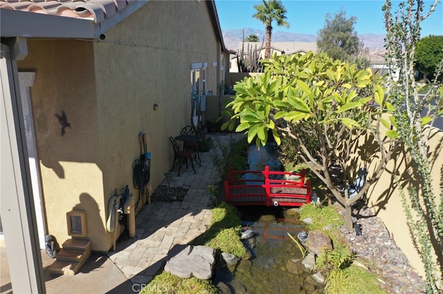 view of side of home featuring a patio