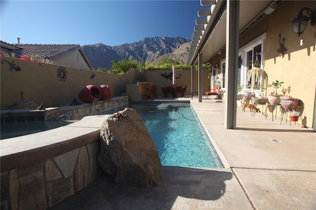 view of swimming pool featuring a mountain view