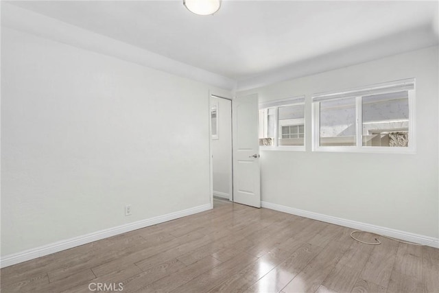 spare room with light wood-type flooring