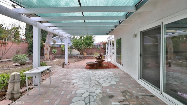 view of patio / terrace featuring fence and a pergola