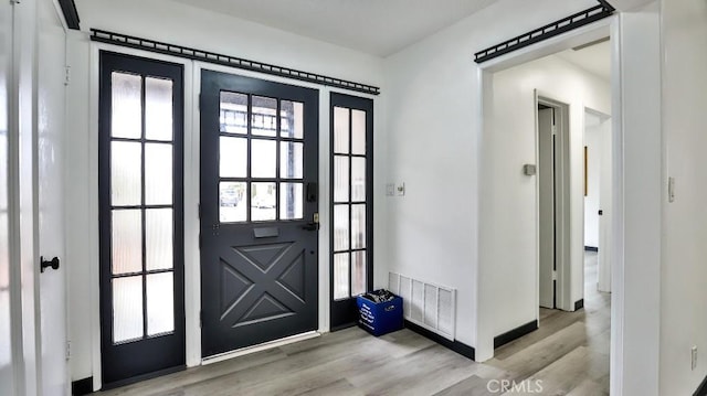 entrance foyer featuring visible vents and light wood-style floors