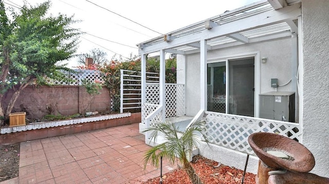 view of patio / terrace featuring fence and a pergola