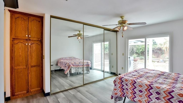 bedroom with access to exterior, a ceiling fan, a closet, and light wood finished floors