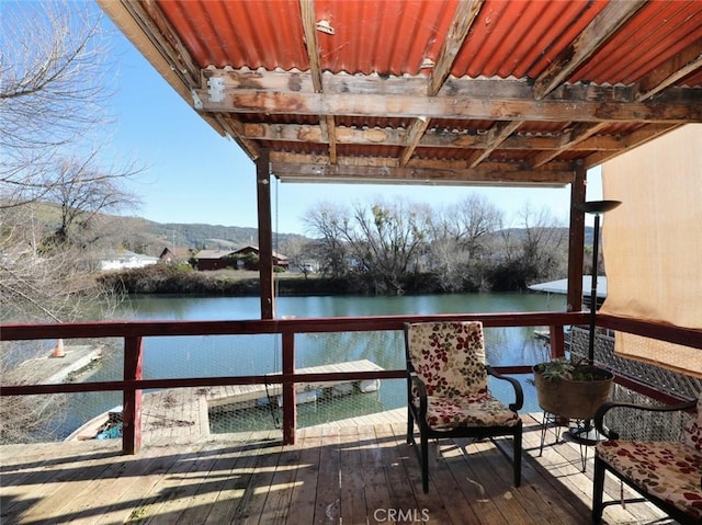 dock area with a deck with water view