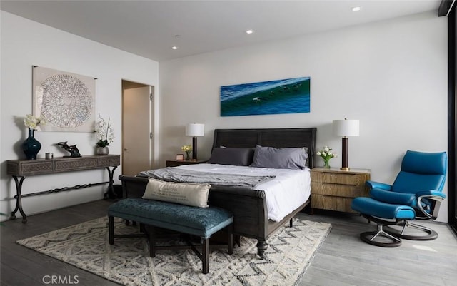 bedroom with hardwood / wood-style floors