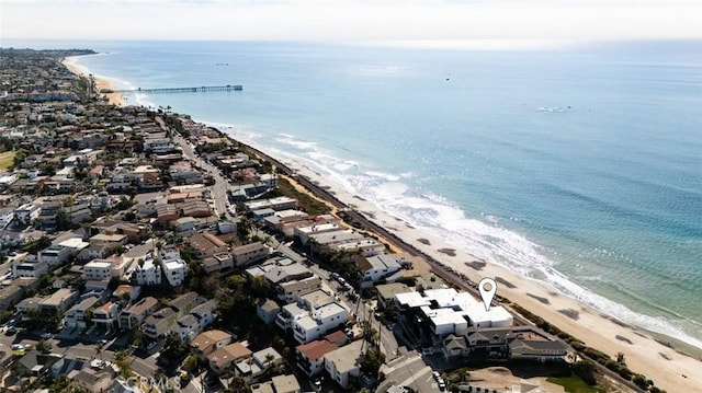 drone / aerial view with a view of the beach and a water view