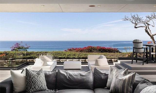 view of patio / terrace with a water view and an outdoor hangout area