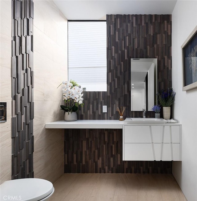 bathroom with vanity and toilet