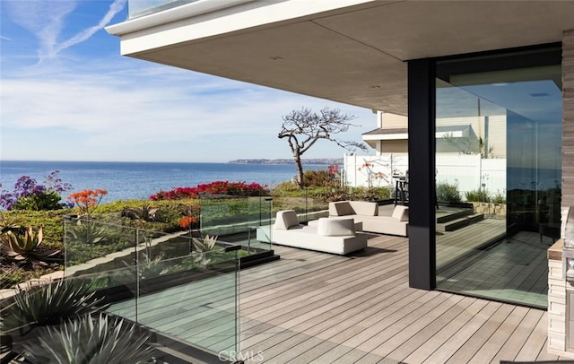 dock area featuring an outdoor living space and a water view