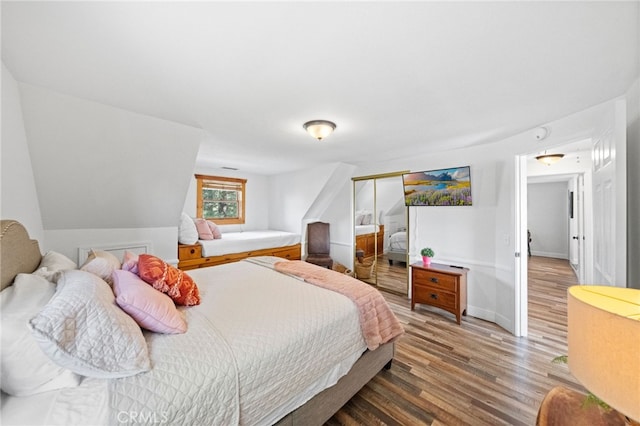 bedroom with hardwood / wood-style flooring and a closet