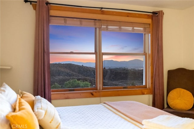 bedroom featuring a mountain view