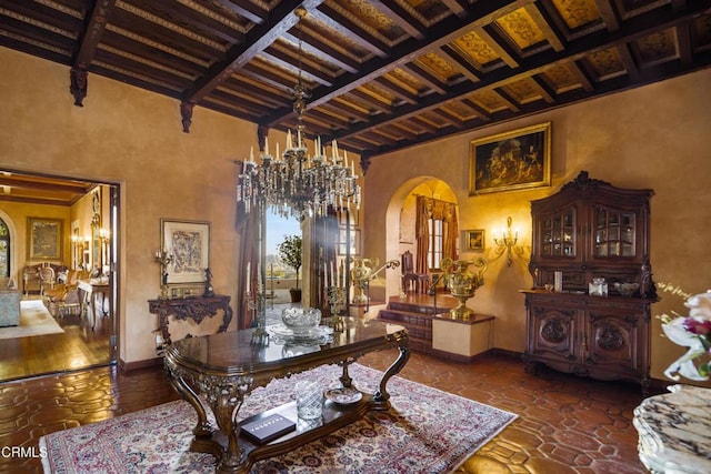 dining area featuring a chandelier, coffered ceiling, and beamed ceiling