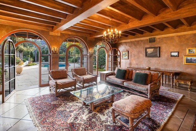 interior space featuring a chandelier, french doors, and beamed ceiling