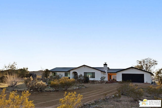 ranch-style house featuring a garage