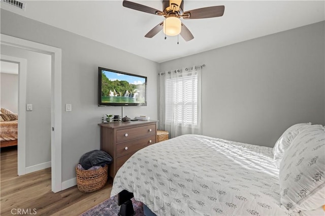 bedroom featuring ceiling fan and light hardwood / wood-style flooring