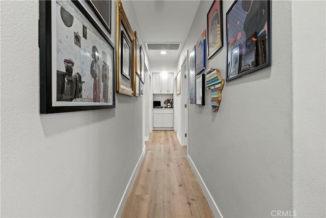 hallway featuring light wood-type flooring