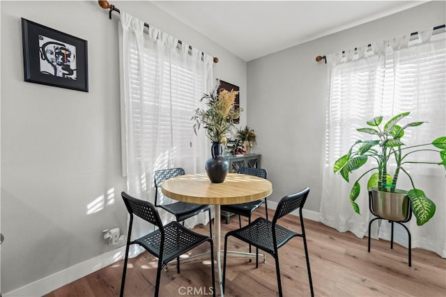 dining area with light hardwood / wood-style flooring