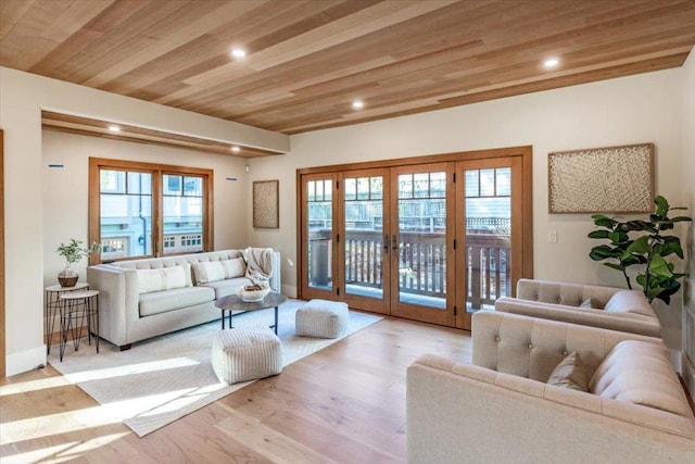 living room with wood ceiling, french doors, and light wood-type flooring