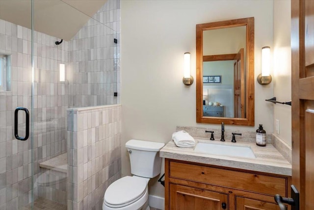 bathroom with toilet, vanity, lofted ceiling, and walk in shower