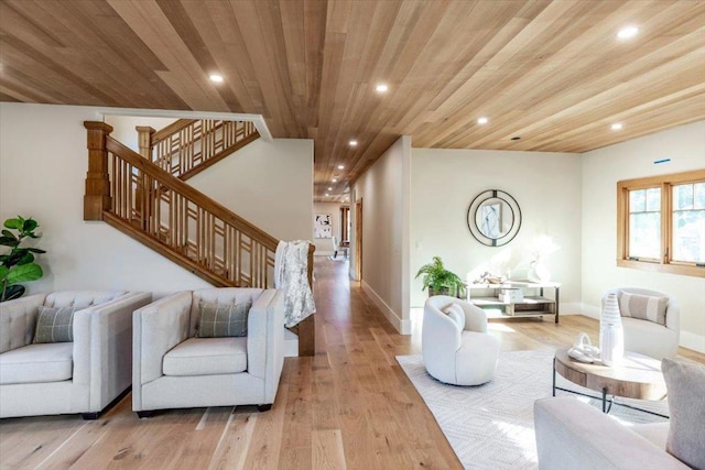 living room featuring wood ceiling and light hardwood / wood-style flooring