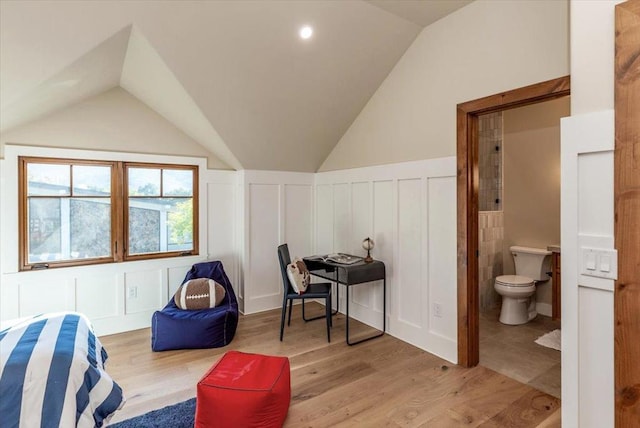 interior space featuring light wood-type flooring and lofted ceiling