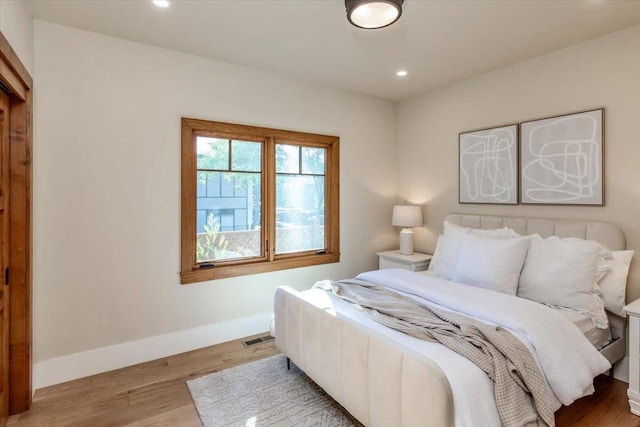 bedroom with light hardwood / wood-style floors