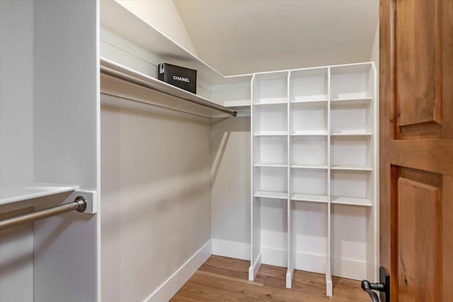 walk in closet featuring light hardwood / wood-style flooring