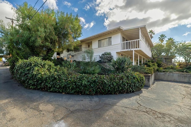 view of home's exterior featuring a balcony