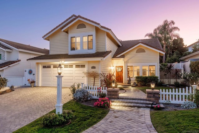 front facade with a garage