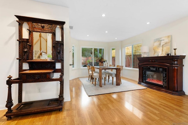 dining space with light hardwood / wood-style floors