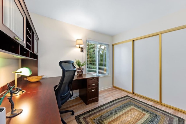 office with light hardwood / wood-style flooring