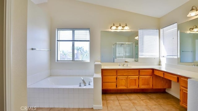 bathroom featuring separate shower and tub, lofted ceiling, tile patterned flooring, and vanity