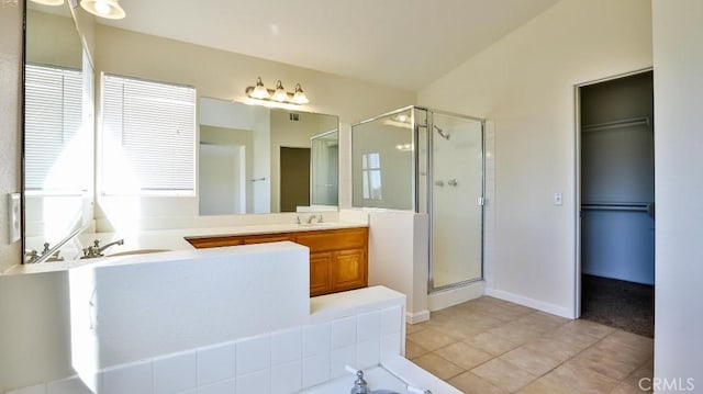 bathroom with tile patterned floors, vanity, and independent shower and bath