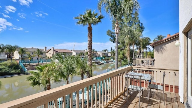 balcony featuring a water view