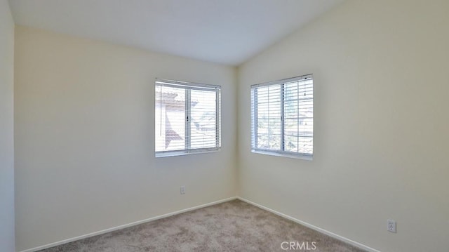 16195 Isla Maria Cir, Moreno Valley, CA 92551 - unfurnished room with light carpet, vaulted ceiling, and baseboards