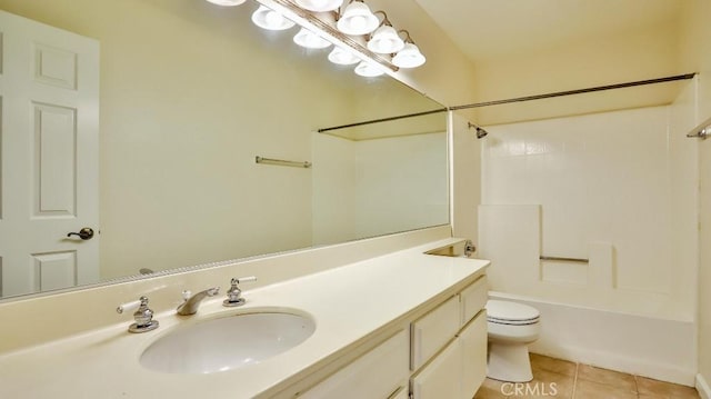 full bathroom with tile patterned floors, toilet, vanity, and washtub / shower combination