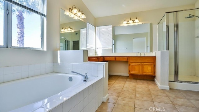 bathroom featuring tile patterned floors, vanity, and shower with separate bathtub