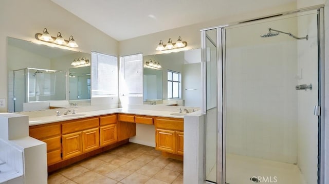 bathroom with vanity, tile patterned flooring, and a shower with door