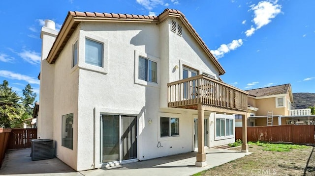 back of property featuring a patio area, central AC unit, and a balcony