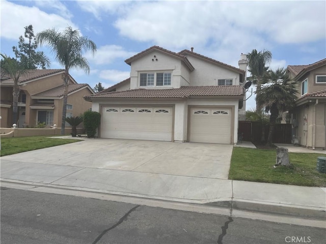 16195 Isla Maria Cir, Moreno Valley, CA 92551 - mediterranean / spanish-style home featuring concrete driveway, a front lawn, a tiled roof, a garage, and stucco siding