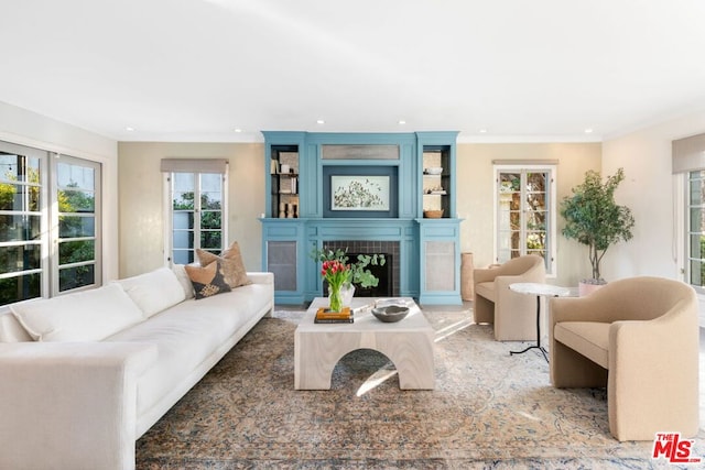 living room with a tiled fireplace