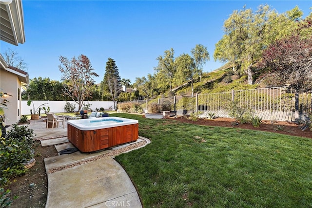 view of yard featuring a hot tub and a patio