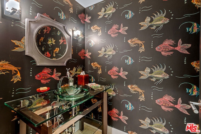 bathroom with tile patterned floors