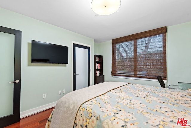 bedroom featuring wood-type flooring